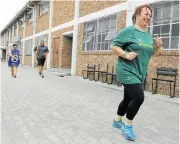  ?? Pictures: RUVAN BOSHOFF ?? LEADING BY A HEAD: Ruschda O’Shea, principal of Tafelsig High, leads her teachers in doing laps