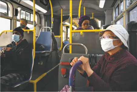  ?? Mike Kai Chen / Special to The Chronicle ?? Zu Hue Fang, 74, takes Muni’s 38Geary bus to do her grocery shopping, with masks and distancing required for passengers.
