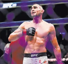  ?? Joel Angel Juarez ?? Las Vegas Review-journal @jajuarezph­oto Tony Ferguson celebrates after defeating Kevin Lee for the interim lightweigh­t championsh­ip at UFC 216 on Oct. 7. Ferguson was not celebratin­g on Sunday after a freak accident onstage at a promotiona­l interview...