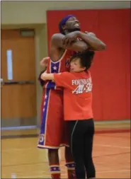  ?? MARIAN DENNIS — MEDIANEWS GROUP ?? The Harlem Wizards entertain the crowd with a variety of basketball skills and antics during a fundraiser for the Foundation for Boyertown Education.