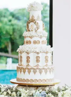 ?? ?? LEFT We planned a wedding in ivory with gold details to make it look like a wedding at Mount Olympus.