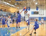  ?? Adam Dortch ?? Wyatt York drives the lane for the bucket and the foul in Gordon Central’s senior night, falling to Model 80-56.