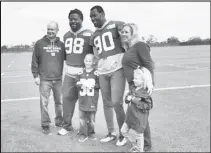  ??  ?? Football fan Hayden (center) with his family and Giants Jason Pierre-Paul (No. 90) and Damon Harrison (No. 98).