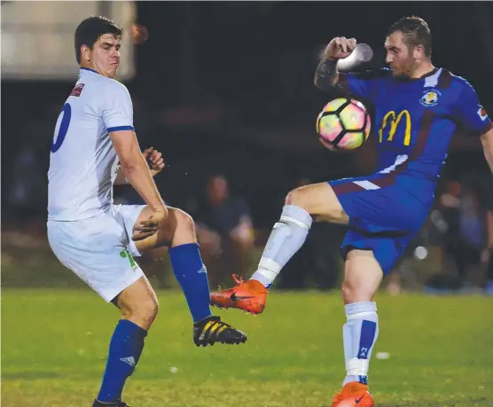  ?? NO QUARTER: Brothers player Anthony Roulston ( and Olympic's Stephen Blackburn clash in Saturday night’s showdown. Picture: EVAN MORGAN ?? left)