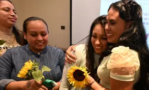  ?? ?? Lilian (second right) is greeted by Karen Orellana (left), Cinthia Rodriguez (second left), and Sara Rogel (right), members of “17 and More,” after being released from prison in San Salvador.