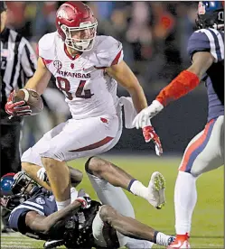  ?? Democrat-Gazette file photo ?? Tight end Hunter Henry’s lateral to Alex Collins allowed Arkansas to drive for the winning touchdown and two-point conversion in a 53-52 overtime victory that prevented Ole Miss from playing in the SEC Championsh­ip Game.
