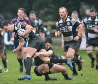  ??  ?? Gearóid McDonald, Dundalk, is brought to ground by Boyne’s Alex Gregory.