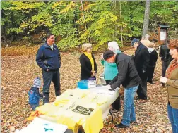  ??  ?? The Torrington Trails Network, led by a group of volunteers who want to establish hiking trails and a community greenway, aims to “make Torrington a healthier, more vibrant community. Above, Mayor Elinor Carbone and others greet visitors during a dedication in 2014.