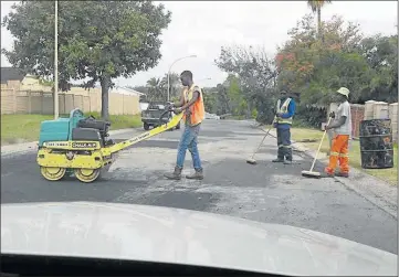  ?? Picture: MARK ANDREWS Picture: NCEDO KUMBACA ?? MEN AT WORK: McGovern Street in Amalinda is having the facelift of its life in time for Christmas