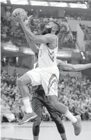  ?? Darron Cummings / Associated Press ?? James Harden leaves Thaddeus Young and the Pacers in his dust during Sunday’s game. The Rockets guard scored 26 points and added 15 assists.