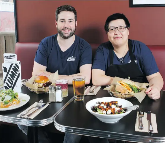  ?? PHOTOS: JIM WELLS ?? Owner Jeremy Milligan, left, and chef Wall Wo relax at Alumni Sandwich &amp; Liquor Bar, which opened its doors in May.