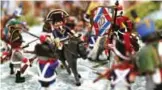  ??  ?? Details of scenes depicting Napoleon Bonaparte’s life made with playmobil painted by Frederic Pierrot at the Naporama museum in Ajaccio, on the French Mediterran­ean island of Corsica.