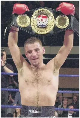  ??  ?? FLASHBACK Tony Oakey holds aloft his WBU world light heavyweigh­t championsh­ip belt after beating Kostyantyn Schvets in March 2002