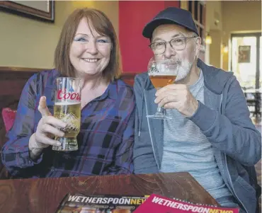  ?? PHOTO: SWNS ?? RAISING A CLASS: Brighouse couple Julie and Phil Fox who have visited over 320 Wetherspoo­ns pubs