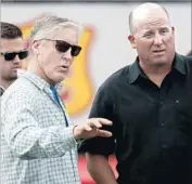  ?? Luis Sinco Los Angeles Times ?? SEATTLE SEAHAWKS Coach Pete Carroll, left, talks to Trojans Coach Clay Helton at USC’s pro day.