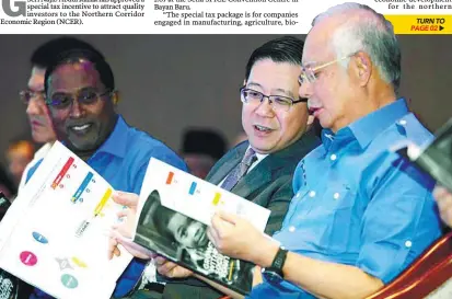  ??  ?? ... Penang Chief Minister Lim Guan Eng having a quiet word with Najib during the launch of the NCER Blueprint 2.0 as Perak Mentri Besar Datuk Seri Zambry Abdul Kadir looks on.