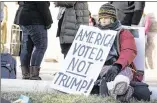  ?? DAVE CREANEY ?? Marilyn Harris holds a sign in front of the Capitol during a Dec. 19 rally urging Texas electors to vote for anyone other than Donald Trump.