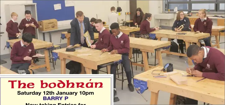  ??  ?? Principal, Tomás Sharkey with students in the woodwork room at Coláiste Chú Chulainn.