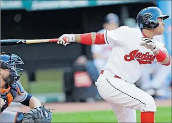  ?? [TONY DEJAK/THE ASSOCIATED PRESS] ?? Jose Ramirez’s RBI double off Astros starter Lance McCullers helped the Indians take a 3-0 lead in the first inning.