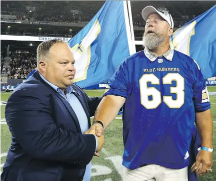  ?? KEVIN KING/FILES ?? Former Winnipeg Blue Bombers offensive lineman Chris Walby, right, shown during a ceremony in Winnipeg last year, says he fears the CFL’s new rule banning padded practices during the regular season will backfire, causing more injuries than it prevents.