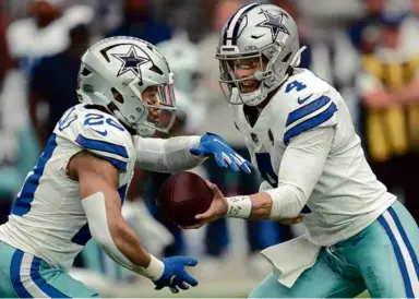  ?? ROSS D. FRANKLIN/ASSOCIATED PRESS ?? Tony Pollard (left) and Dak Prescott have not had the Cowboys offense clicking yet.