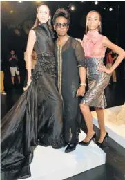  ?? Picture: GETTY IMAGES ?? RUFFLED: David Tlale with models wearing two of his creations at fashion week in Manhattan