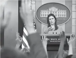  ?? Pablo Martinez Monsivais/Associated Press ?? ■ White House press secretary Sarah Huckabee Sanders points Monday as she fields questions from members of the media during the daily briefing in the Brady Press Briefing Room of the White House.