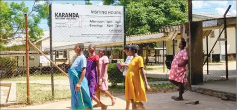  ?? ?? Pregnant women take a walk outside the maternity ward at Karanda Mission Hospital in Mt Darwin