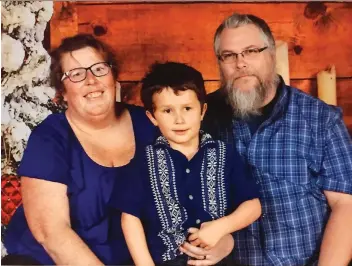  ??  ?? Krista and Robert Ryan’s five-year-old son Xavier is on a long waiting list for Intensive Behavioura­l Interventi­on therapy. His mother worries the Ontario government’s lifetime funding cap may fall short of what is needed.