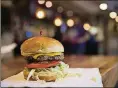  ?? RYAN SODERLIN/THE WORLD-HERALD VIA AP, FILE ?? This is the Impossible Burger at Stella’s in Bellevue, Neb. It’s a burger made from plant protein.