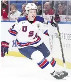  ?? NATHAN DENETTE/CP ?? Trent Frederic of the U.S. celebrates one of his four goals on Friday against the Czech Republic.