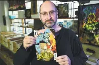  ?? Erik Trautmann / Hearst Connecticu­t Media ?? Dave Kruseski, owner of Heroes Comics &amp; Cards in Norwalk, displays the first issue of a new comic book series “Meet the Skrulls,” which takes place, at least partially, in Stamford.