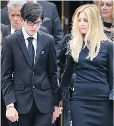  ??  ?? Mark Boscariol’s son Andreas and wife Daena after the funeral service.