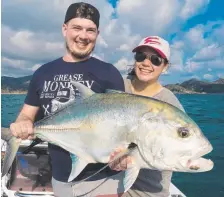  ?? Zac and Cassie Pighin with Zac’s impressive GT before release ( left) and also about to release a big barracuda ( right). ??