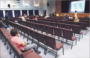  ?? Wally Skalij Los Angeles Times ?? MOST OF THE CHAIRS are empty at a community meeting at Monroe High School last month for parents and teachers to give input on the search for a new schools superinten­dent.