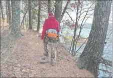  ?? STEVE FAGIN/SPECIAL TO THE DAY ?? Sections of the Pachaug Trail hug the north shore of Beach Pond in Voluntown.