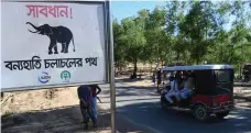  ?? AFP ?? The sign says Warning – Route for Wild Elephants. Refugees’ allocated land is where wild elephants search for food