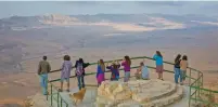  ?? (Dafna Tal/Tourism Ministry) ?? VISITORS GAZE DOWN into the Ramon Crater, 85 km. south of Beersheba.