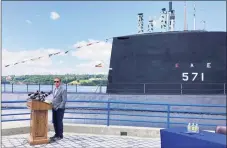  ?? Susan Haigh / Associated Press ?? Gov. Ned Lamont on Aug. 2 at the Submarine Force Museum in Groton, a short distance up the Thames River from the Electric Boat subsidiary of General Dynamics, which has been hiring hundreds of people this year.