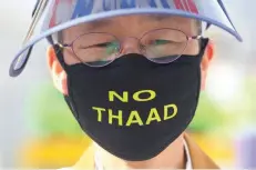  ?? — AFP ?? A South Korean protester rally in Seoul against the deployment of the US Terminal High Altitude Area Defence (THAAD). Seoul on Friday brushed aside US President Donald Trump’s suggestion it should pay for a $1 billion missile defence system the two...