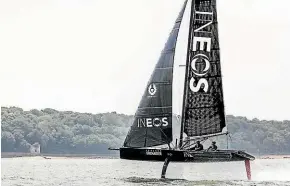  ??  ?? INEOS Team UK foiling on their 28-foot America’s Cup test boat with Sir Ben Ainslie and Giles Scott on board.