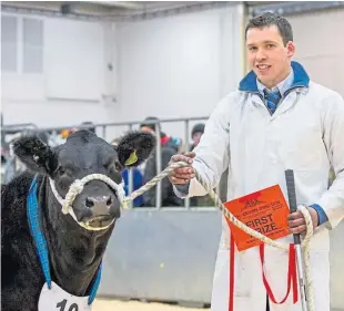  ??  ?? Craig Robertson from Newton of Logierait with a prize-winning calf.