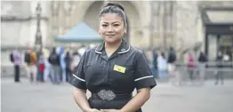  ?? ?? May Parsons, the nurse who administer­ed the first COVID-19 vaccinatio­n in the world, poses outside Westminste­r Abbey before a service celebratin­g the 75th anniversar­y of the NHS on July 5, 2023. (Photo by Leon Neal/getty Images)