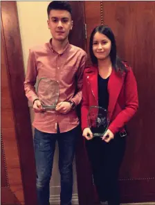  ??  ?? Cian Weldon and Niamh Weldon receiving their awards at the LMETB academic award ceremony for top marks in their leaving cert from O’Carolan College, Nobber.