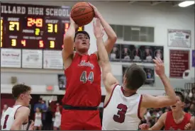  ?? ?? Karsen Homan pulls up for a shot over Willard’s Max Dawson. Homan washuge off the bench for Shelby, scoring 11 points and sharing the team lead in rebounds with eight on Feb. 24.