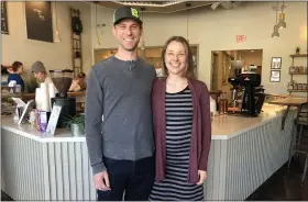  ?? RACHEL RAVINA - MEDIANEWS GROUP ?? Backyard Beans Coffee Company owners Matt and Laura Adams pose for a photo prepandemi­c inside their store on Main Street in Lansdale.