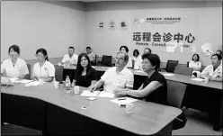  ?? PHOTOS PROVIDED TO CHINA DAILY ?? Georges Andre Mantion (top, center) works with Chinese doctors during his regular visit to the Xinjiang Uygur autonomous region. His expertise in the treatment of digestive tumors has helped local hospitals in the fight against a hepatic disease known...