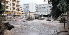  ??  ?? MUD and debris cover the ground after a storm on the popular tourist island of Mallorca, Spain, yesterday.