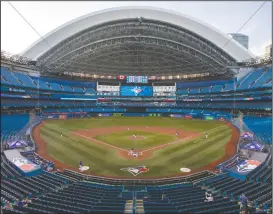 ?? CP PHOTO CARLOS OSORIO ?? The Toronto Blue Jays play an MLB intrasquad baseball game in a nearly empty Rogers Centre in Toronto, Thursday, July 9. Rogers Communicat­ions Inc. says it was exploring the future of its Toronto stadium prior to the COVID-19 pandemic, but now the virus has caused it to deprioriti­ze the matter.