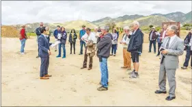  ?? Cory Rubin/The Signal ?? Associate Planner Hai Nguyen speaks to a crowd as he gives a tour of the site of the proposed Sand Canyon Country Club on Tuesday afternoon.